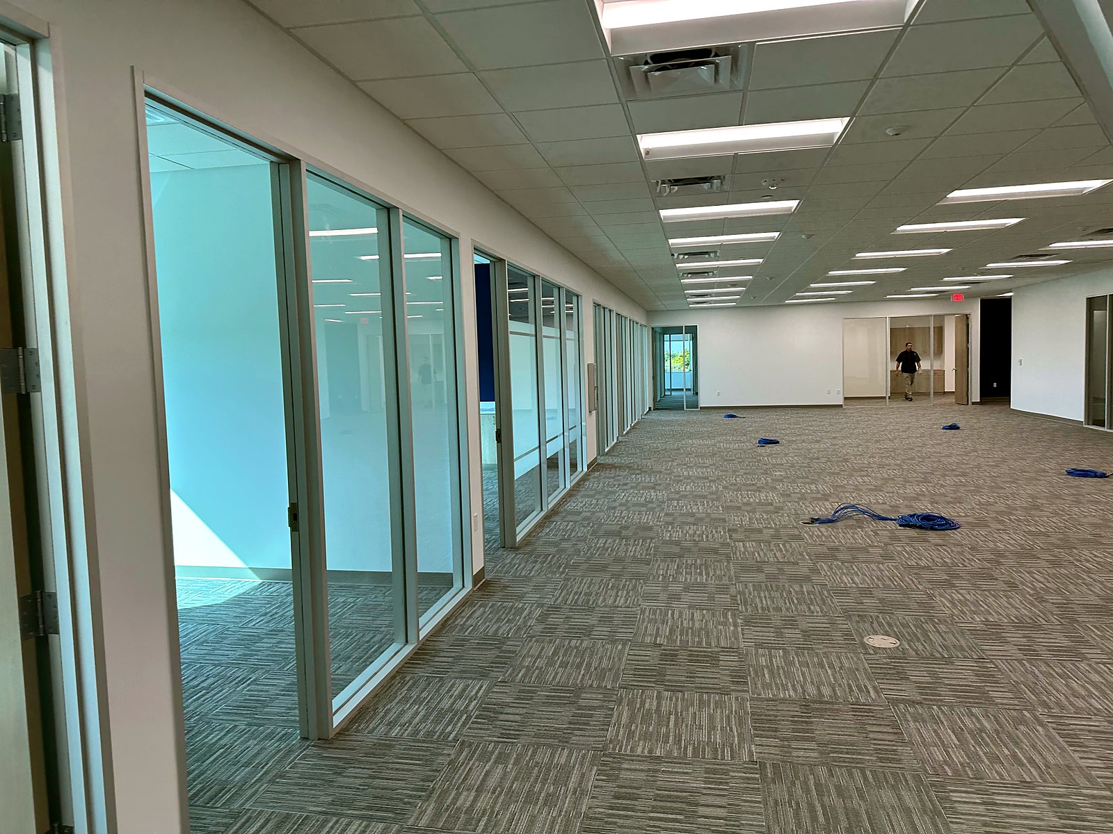 Finished glass office corridor in commercial tenant build-out by Brunt & Company Inc.