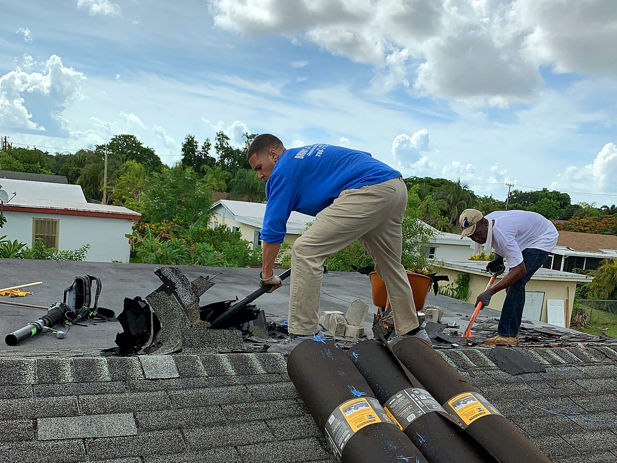Roofing crew installing new underlayment during an insurance-claim roof replacement by Brunt & Company
